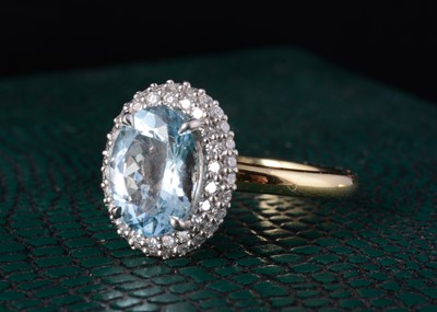 Lot 57 - An 18ct gold aquamarine and diamond set dress ring