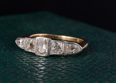 Lot 58 - An 18ct gold art deco platinum and diamond set five stone dress ring