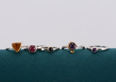 Lot 89 - A set of silver gem set stacking rings