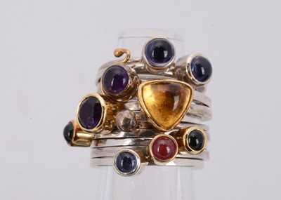 Lot 90 - A set of five gem set silver and gold dress rings