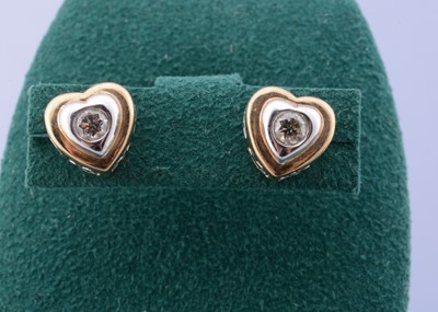 Lot 110 - A pair of 9ct gold diamond set ear studs
