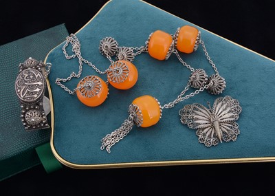 Lot 118 - A North African white metal bangle