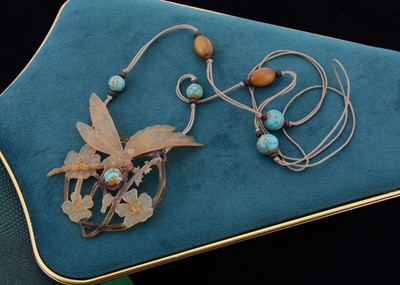 Lot 126 - An art nouveau horn carved pendant by Elizabeth Bonte