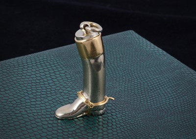 Lot 170 - An 18ct gold Asprey of London two colour riding boot and spur pendant