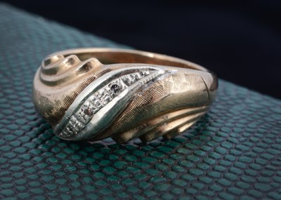 Lot 186 - A 9ct gold two colour diamond set dress ring