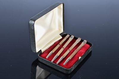Lot 230 - A set of four silver Bridge retractable pencils