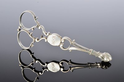 Lot 240 - A pair of George III silver sugar nips