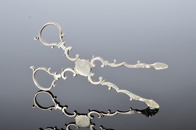 Lot 242 - A pair of George III silver sugar nips
