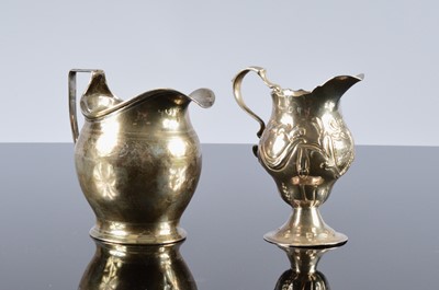 Lot 258 - Two Georgian silver milk jugs