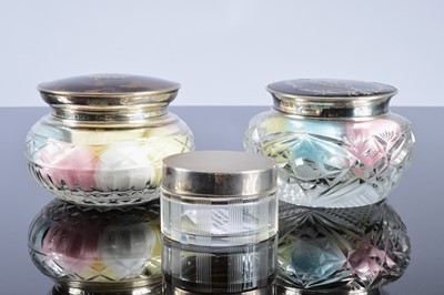 Lot 285 - Two George V period cut glass powder puff pots with silver and tortoiseshell lids