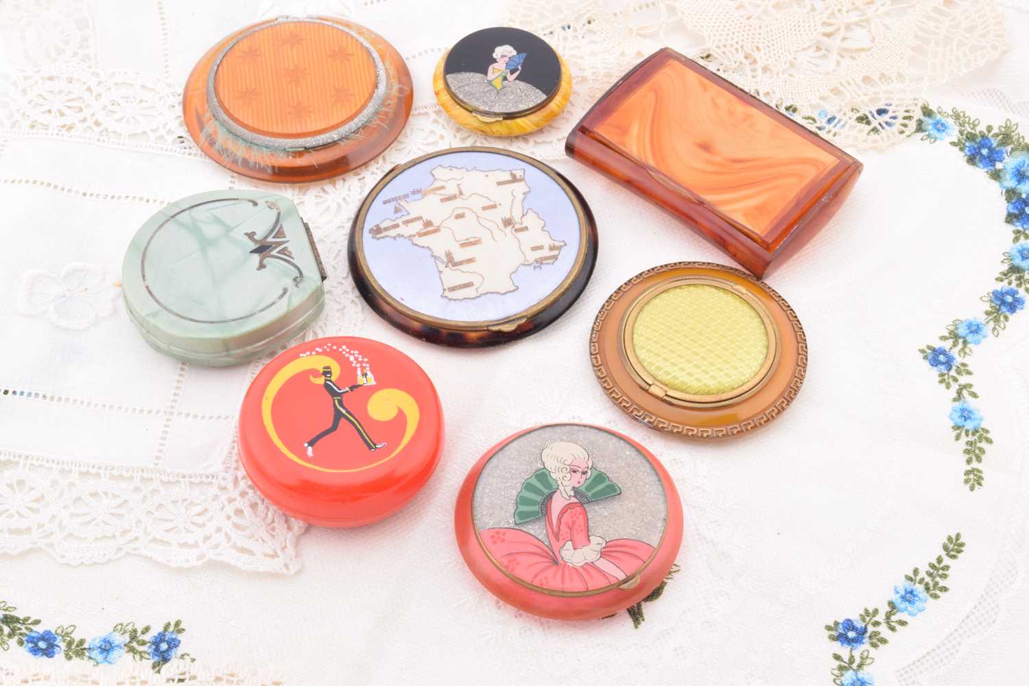 Lot 397 - Bakelite, Celluloid and plastic compacts