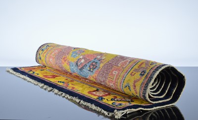 Lot 526 - An early 20th century Chinese temple carpet
