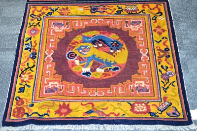 Lot 526 - An early 20th century Chinese temple carpet
