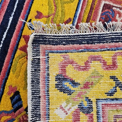 Lot 526 - An early 20th century Chinese temple carpet