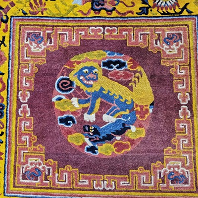 Lot 526 - An early 20th century Chinese temple carpet
