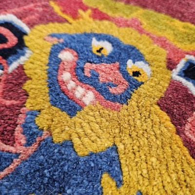 Lot 526 - An early 20th century Chinese temple carpet