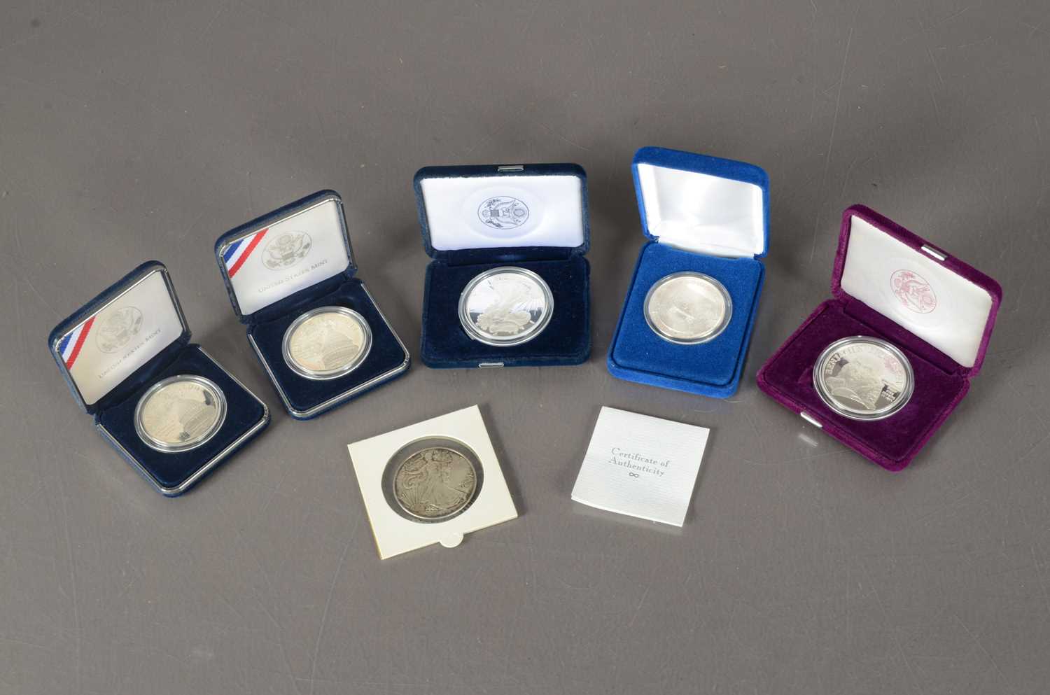 Lot 25 - A collection of six United States silver coins and medallions