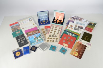 Lot 37 - A collection of uncirculated world coin sets and coin covers