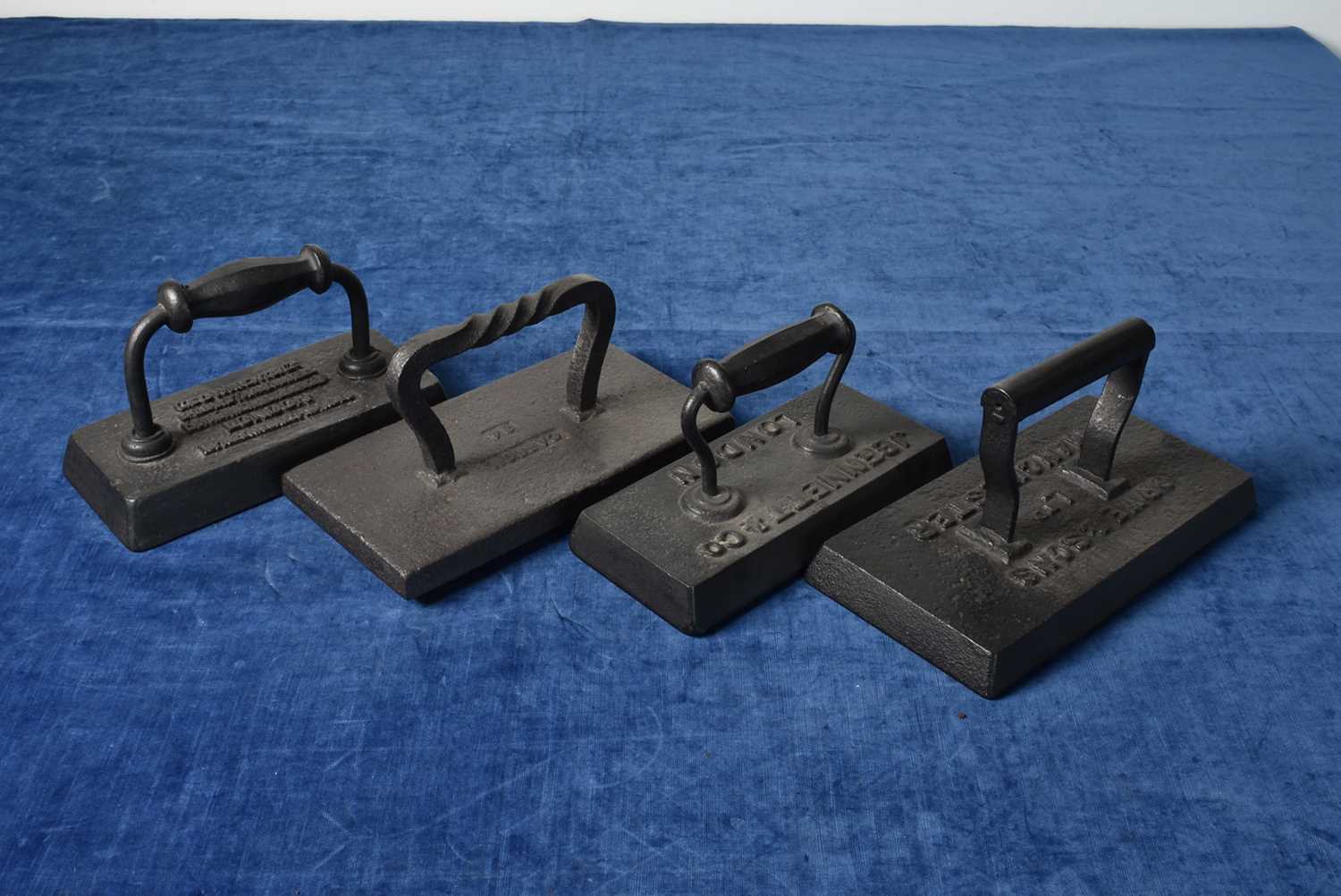 Lot 14 - A group of four large Billiard irons