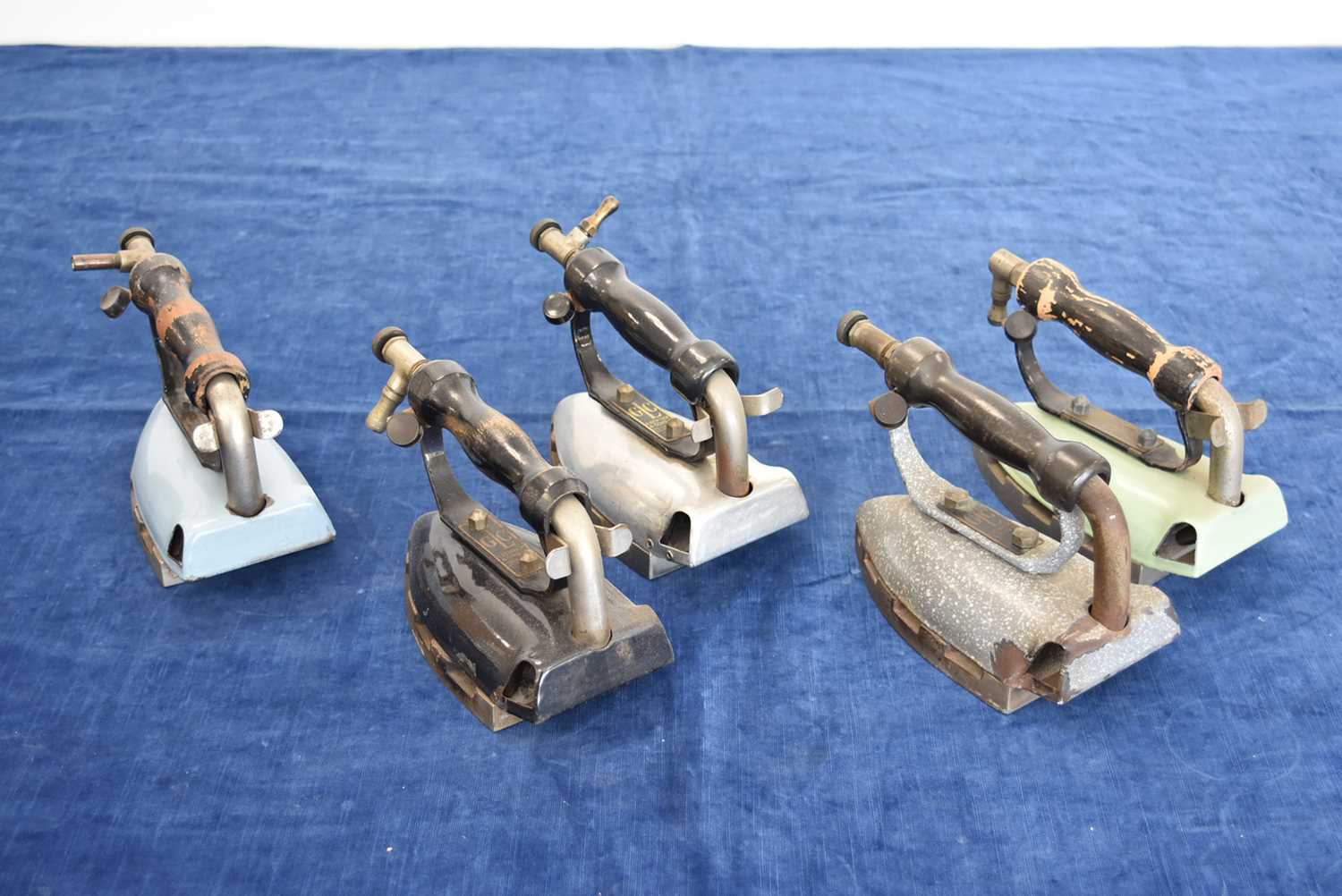 Lot 34 - A group of five A Kendrick & Sons Ltd 'GLC' irons