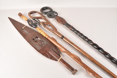 Lot 282 - Three African Walking Canes and a Paddle