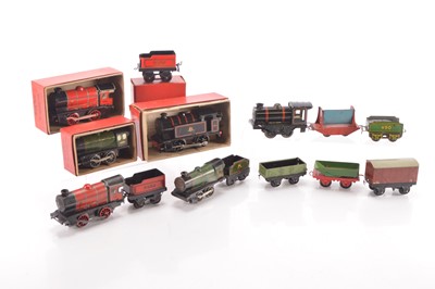 Lot 487 - Hornby 0 Gauge M Series and Type 101 Clockwork Engines some with tenders and Rolling stock  and Brimtoy Engine and other makers Rolling Stock (12, including Tenders)