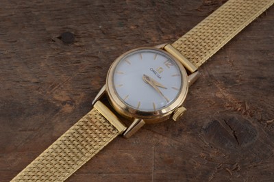 Lot 217 - 1950s  Omega manual wind gold plated ladies wrist watch on a yellow metal strap