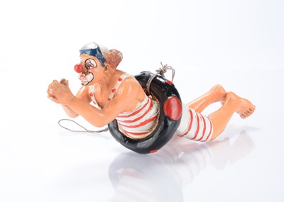 Lot 151 - A resin model of a clown diving the through ring