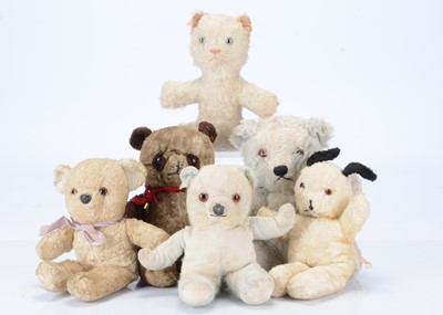 Lot 272 - Six vintage unjointed babies crib/pram teddy bears and soft toys
