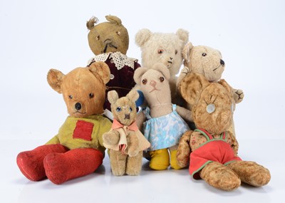 Lot 274 - Seven  unjointed dressed teddy bears