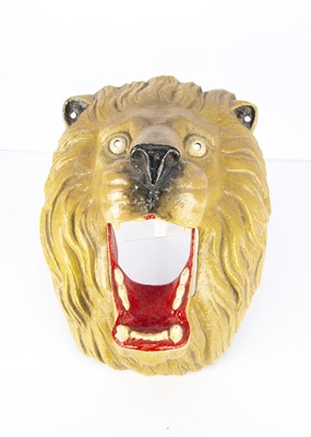 Lot 433 - An English cast aluminium fairground Lion’s Head ball toss game 1960s