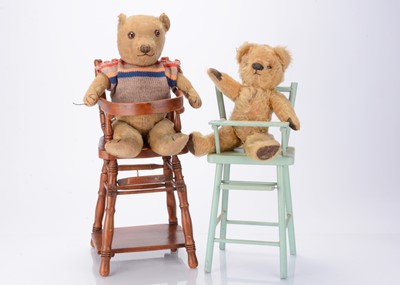 Lot 570 - Two 1930s British teddy bears in high chairs