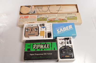 Lot 517 - Flair Scout Series Kit Model Bi-Plane and Two Boxed Radio Controls (3)