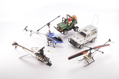 Lot 588 - Large collection of Radio Control Models and Spares including vehicles  Helicopters  RC Controls and spares including Petrol Engine Chargers Tyres Gyro Exhausts Propellers and other parts (qty in five