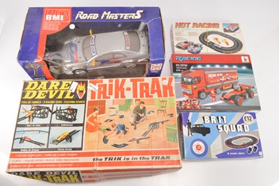 Lot 607 - Tri-ang Spot-On Trik Trak and Road Masters RC Car two battery Slot car sets and Ausini Lego style Racing Construction Set (5)