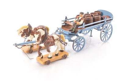Lot 618 - A metal and plaster vintage model of a repainted Brewers Dray with Horses on wooden base with wheels