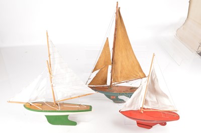 Lot 657 - Three wood and metal Pond Yachts (3)