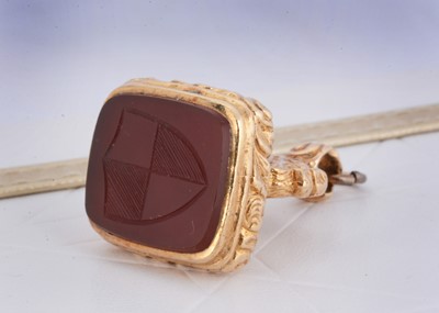 Lot 1 - A 19th Century carnelian gilt metal fob seal