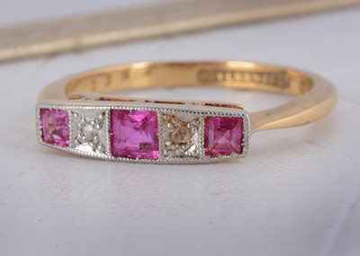 Lot 5 - An early 20th Century 'Covenant Reg' 18ct gold and platinum set five stone ruby and diamond dress ring