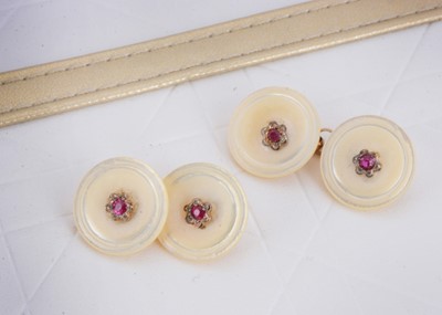Lot 6 - A pair of mother of pearl and synthetic ruby button cufflinks