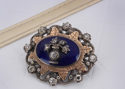 Lot 18 - A George VI silver, enamel and paste set oval brooch