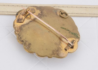 Lot 38 - A 19th Century oval gilt metal black enamel and plaited hair mourning brooch