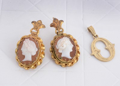 Lot 54 - A pair of carved shell cameo and gilt metal drop earrings