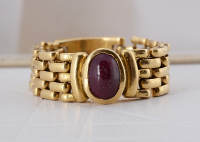 Lot 63 - An 18ct gold ruby chain ring