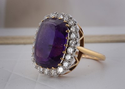 Lot 65 - An 18ct gold amethyst and diamond cluster ring