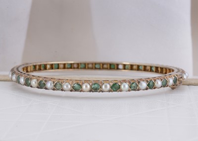 Lot 78 - An Indian emerald and pearl silver gilt hinged bangle