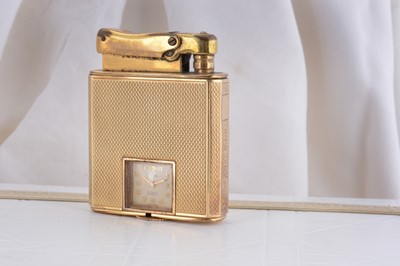Lot 80 - A 14ct gold Calibri presentation lighter with clock movement