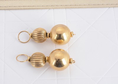 Lot 113 - A pair of 9ct gold double sphere ear drops