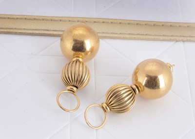 Lot 113 - A pair of 9ct gold double sphere ear drops