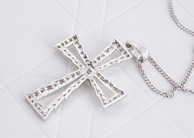 Lot 124 - A contemporary 9ct white gold and diamond set cross pendant